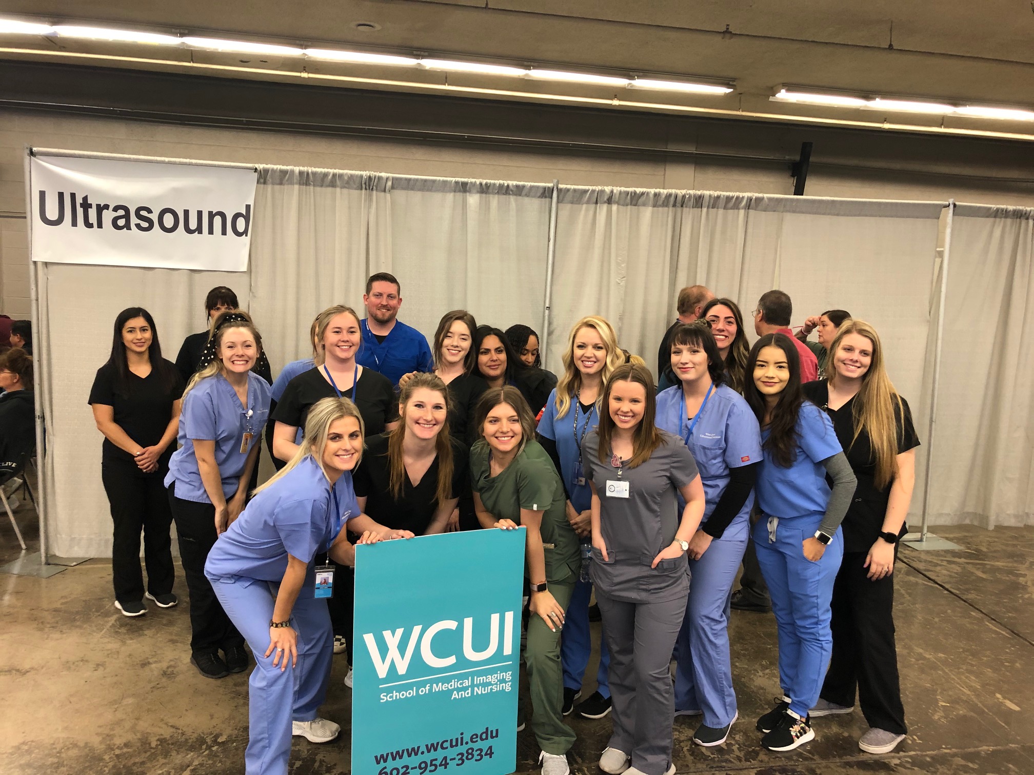 WCUI Student and Staff smiling in a group photo after the MC StandDown